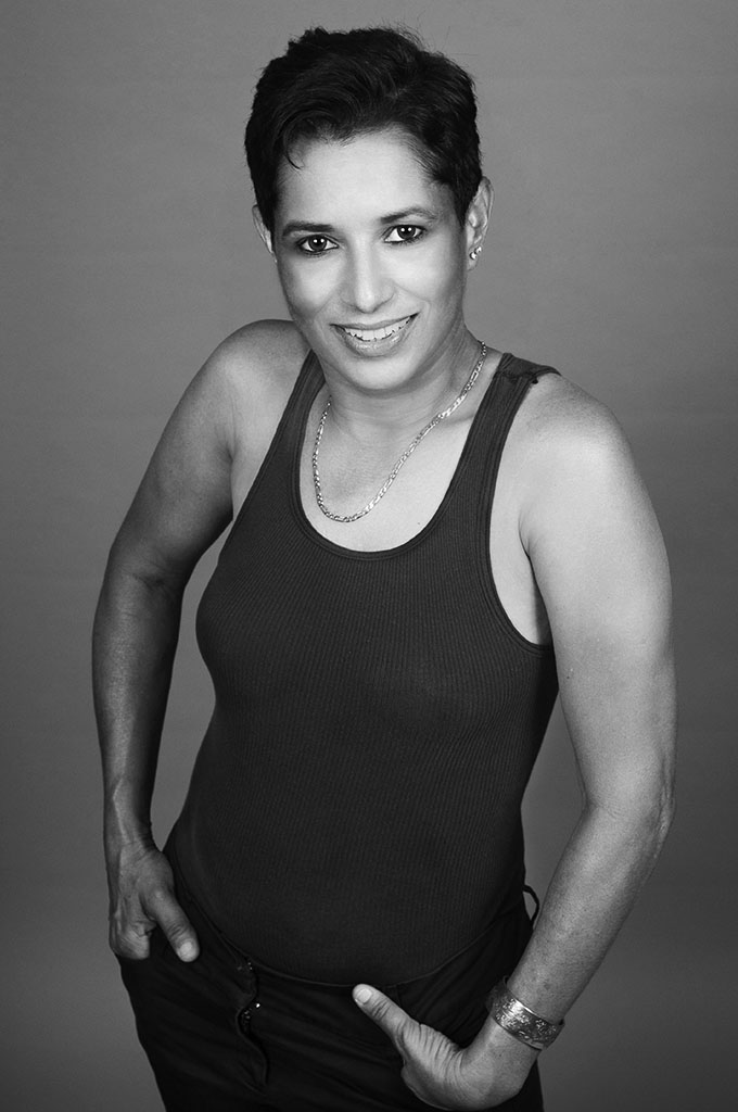 B&W portrait of woman in black tank top. Photo by Alina Oswald.