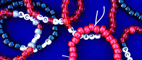 Rise-Up to HIV and ACT UP Bracelets. Photo by Alina Oswald.