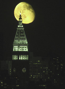 Moon rises over the island of Manhattan. Photo by Alina Oswald.