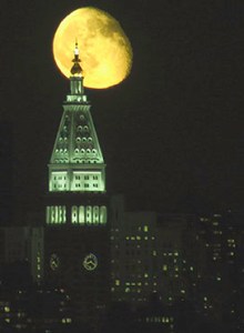 Moon rises over the island of Manhattan. Photo by Alina Oswald.