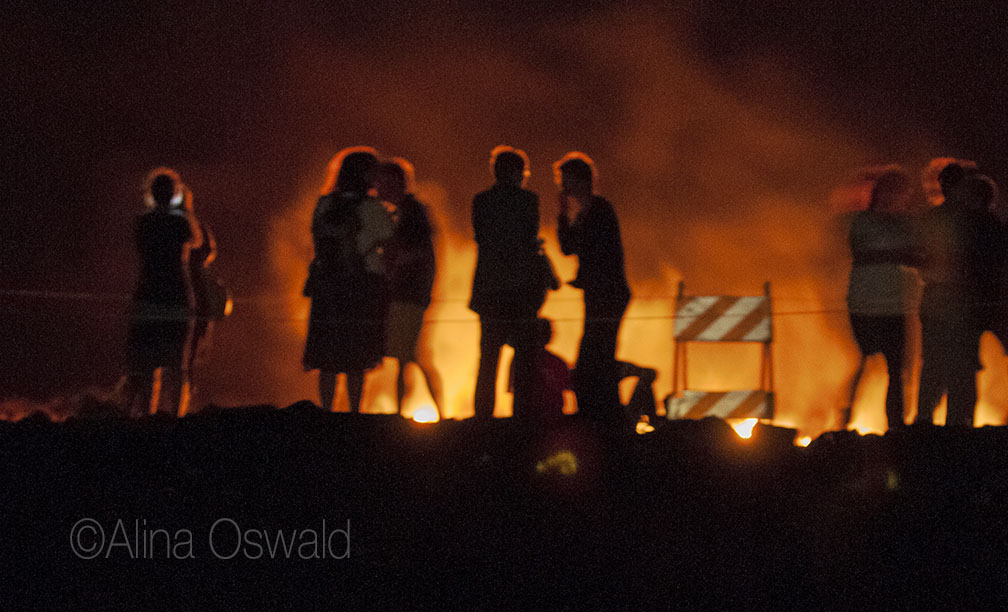 People silhouetted by live lava. Big Island of Hawaii. Photo by Alina Oswald.