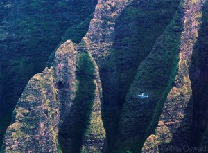 Helicopter flying over Napali Coast. Aerial Photography by Alina Oswald. All Rights Reserved.