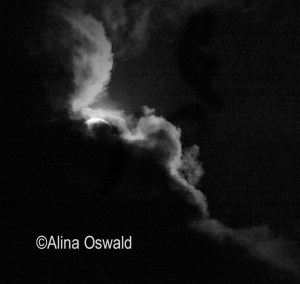 Clouds cover the solar eclipse of August 21, 2017. Photo by Alina Oswald. All Rights Reserved.