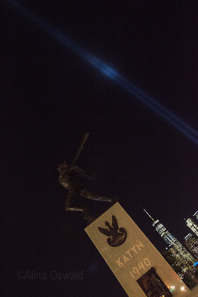 The Katyn Memorial, Lower Manhattan and the 9/11 Tribute Lights. ©Alina Oswald. All Rights Reserved.