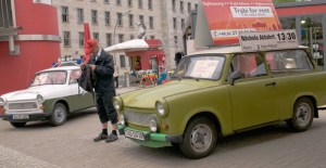Customer at Rent-a-Trabi station, next to the ruins of Berlin Wall, Germany. 