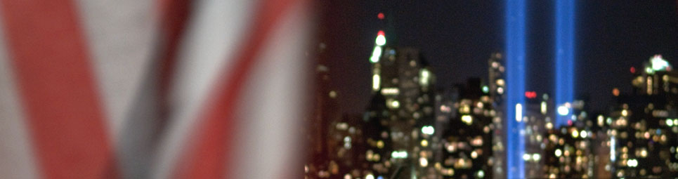 9/11 Tribute Lights framed by the American flag. Photo by Alina Oswald. All Rights Reserved.