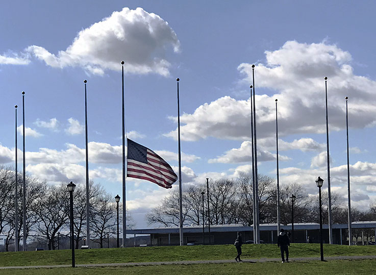 Flags at half staff in Liberty State Park, NJ, during coronavirus pandemic, shortly before the park was closed to the public.