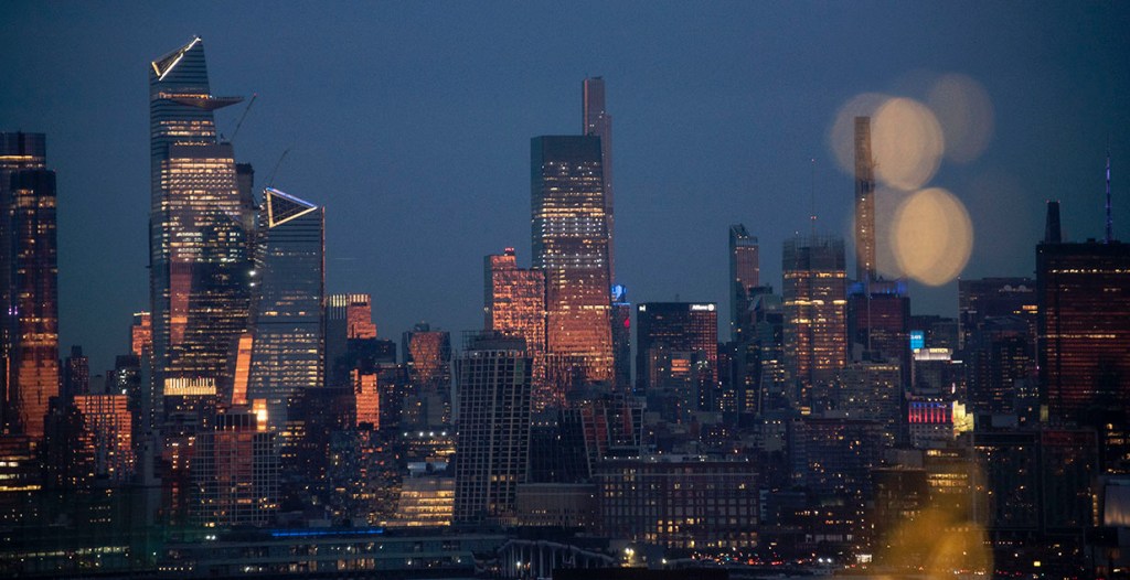NYC after sunset, seen through a foreground bokeh of Christmas lights. ©Alina Oswald. All Rights Reserved.