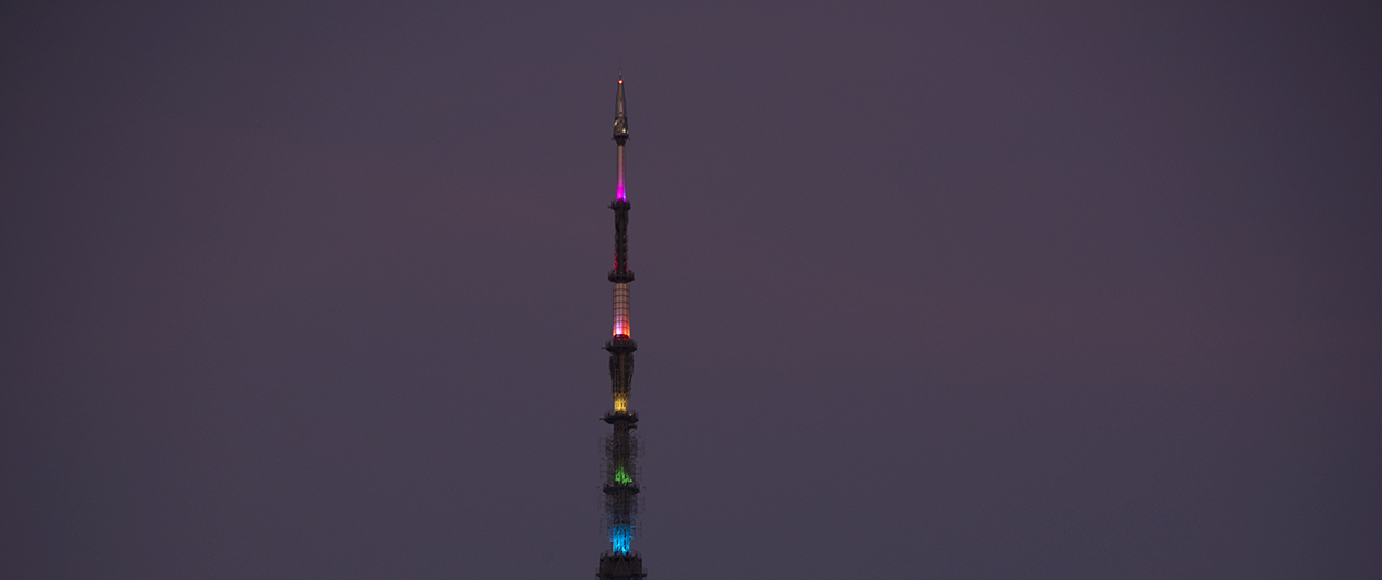 The Freedom Tower antenna is illuminated in rainbow colors for NYC Pride. ©Alina Oswald.