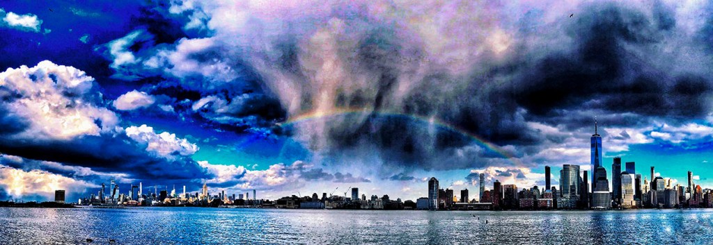 Panoramic view of a rainbow over the NYC skyline. ©Alina Oswald. All Rights Reserved.