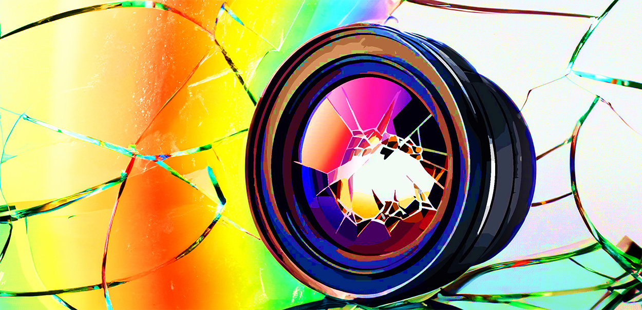 Shattered lens filter surrounded by rainbow light. ©Alina Oswald.