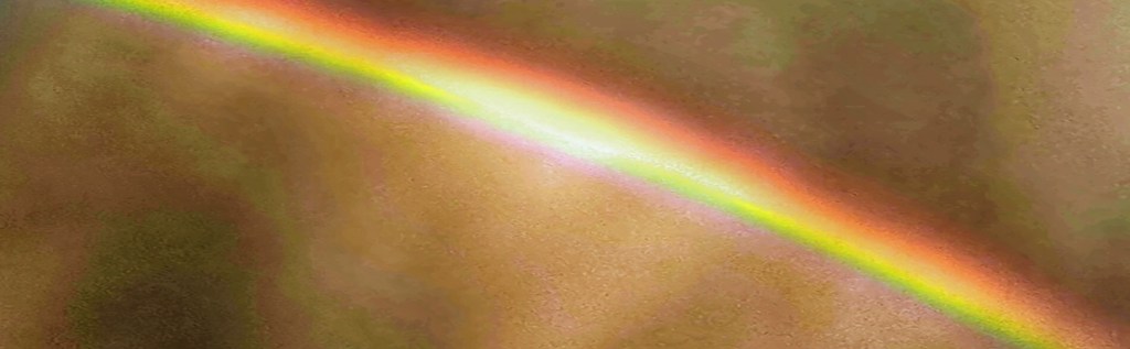 Rainbow over dramatic skyscape. ©Alina Oswald.