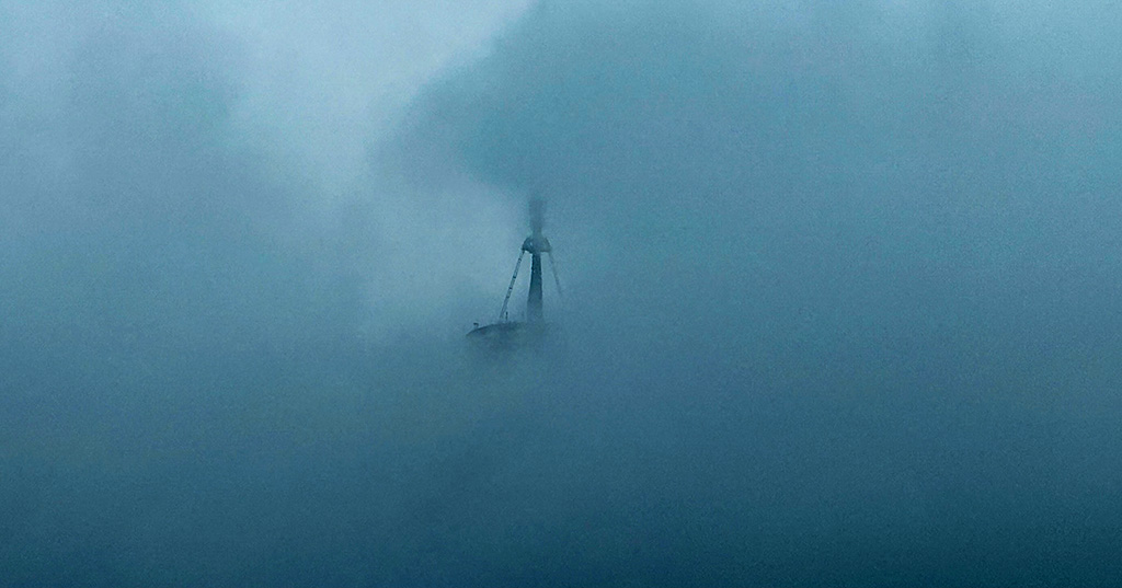 The Freedom Tower breaks through dark and dramatic clouds. ©Alina Oswald.