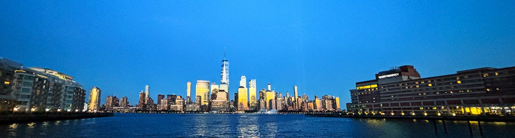 The 9/11 Tribute Lights appear on the Lower Manhattan skyline, the evening of September 11, 2024. View from Jersey City, NJ. Photo ©Alina Oswald.