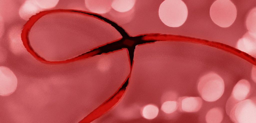 Abstract and experimental visual of AIDS's awareness red ribbon on a red background and bokeh. ©Alina Oswald.